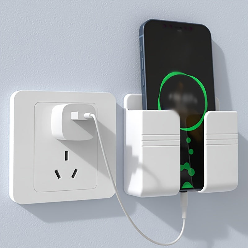 Wall-mounted phone charging holder and organizer for bedside and remote control storage.