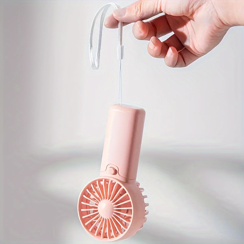 Compact Plastic Mini Handheld Portable Fan, Perfect for Personal Face Cooling On the Go! Battery Operated with Button Control, Ideal for Indoor and Travel Use. Requires 2 AAA Batteries (Not Included). Multiple Components Included.