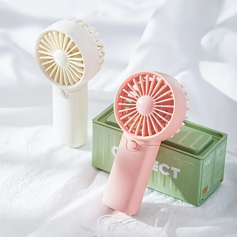 Compact Plastic Mini Handheld Portable Fan, Perfect for Personal Face Cooling On the Go! Battery Operated with Button Control, Ideal for Indoor and Travel Use. Requires 2 AAA Batteries (Not Included). Multiple Components Included.