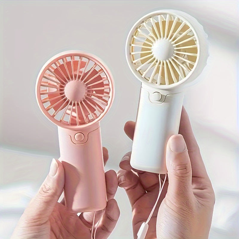 Compact Plastic Mini Handheld Portable Fan, Perfect for Personal Face Cooling On the Go! Battery Operated with Button Control, Ideal for Indoor and Travel Use. Requires 2 AAA Batteries (Not Included). Multiple Components Included.