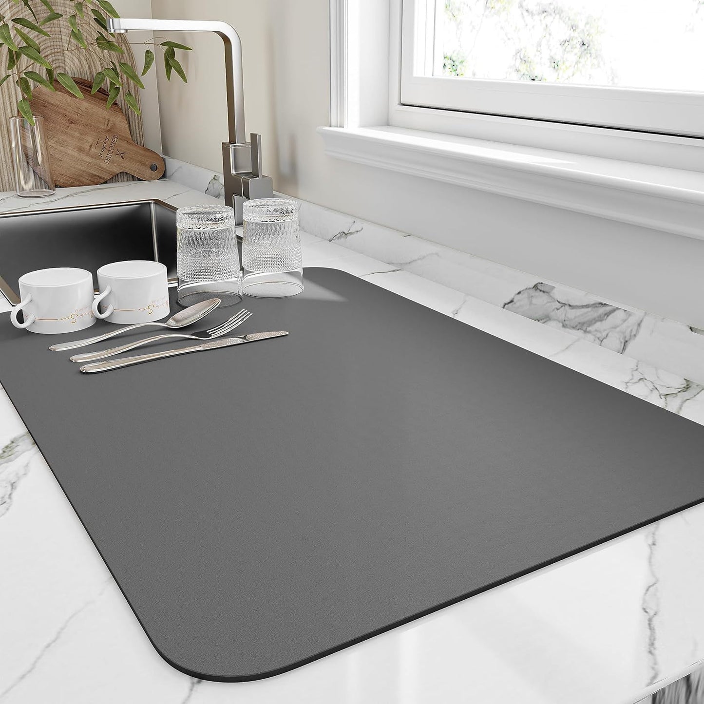 Highly absorbent kitchen drying mat with heat resistant, non-slip rubber backing - ideal for home and restaurant use.