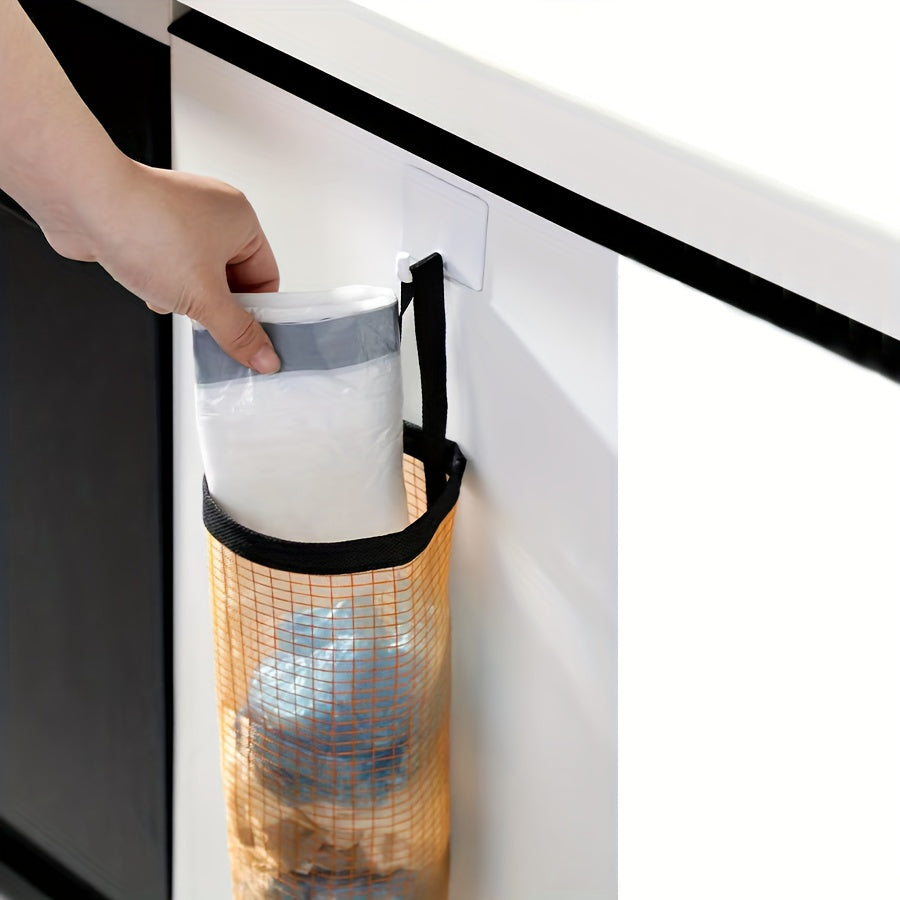 Wall-mounted, foldable mesh organizer for disposable bags, designed to save space in the kitchen.