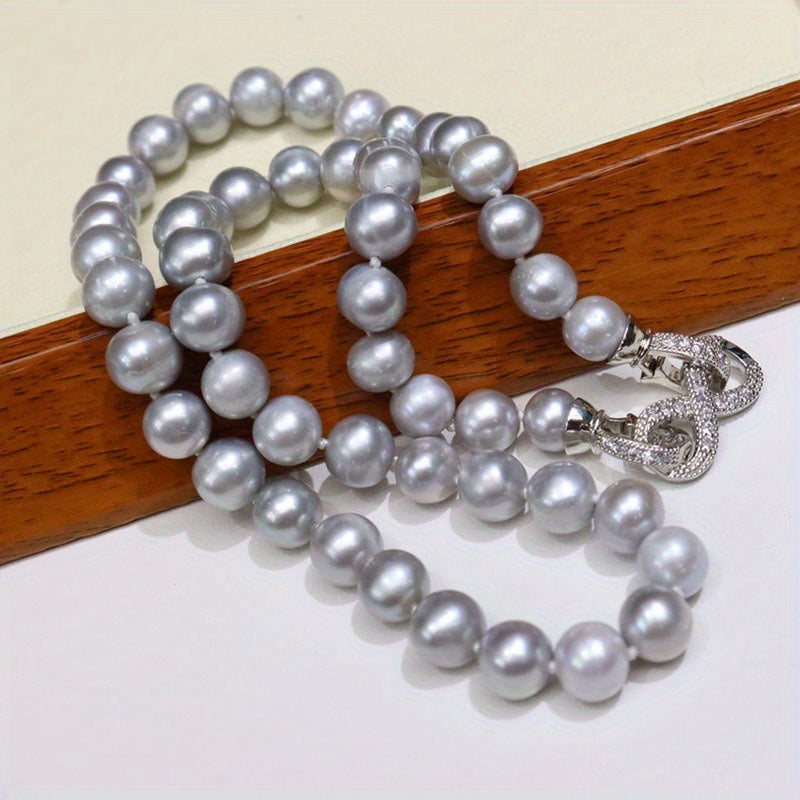 This Vintage Natural Freshwater Pearl Necklace for Men features simple style with Fashionable Grey Pearls showcasing 8 Subtle Imperfections. Ideal for both Daily and Party Wear, this necklace comes in a Gift Box. Made with Natural Stone and suitable for