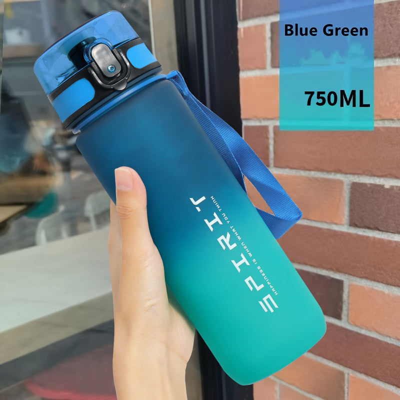 Gradient sports water bottle with strap, leak-proof, large capacity, portable, frosted, BPA-free plastic, flip top lid, ideal for fitness and students.