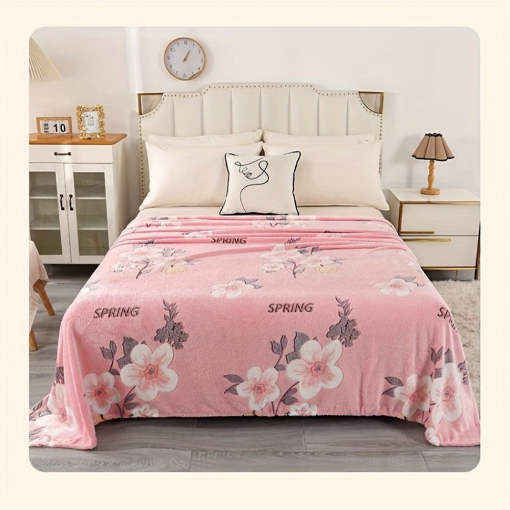 Soft and cozy pink floral print flannel blanket perfect for a variety of uses such as office, camping, travel, home decoration, naps, shawl, sofa, and as a holiday gift. The blanket is comfortable, skin-friendly, and multi-functional.