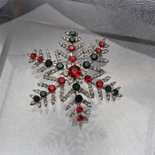 Upgrade your style with this exquisite Luxury Rhinestone Snowflake Brooch Pin. Perfect for adding a touch of elegance to your party attire or as a festive decoration for your clothing, bags, and hats. Elevate your personal style with its sparkling charm