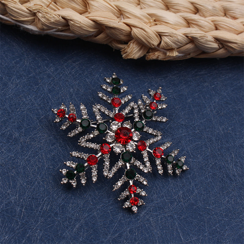 Upgrade your style with this exquisite Luxury Rhinestone Snowflake Brooch Pin. Perfect for adding a touch of elegance to your party attire or as a festive decoration for your clothing, bags, and hats. Elevate your personal style with its sparkling charm