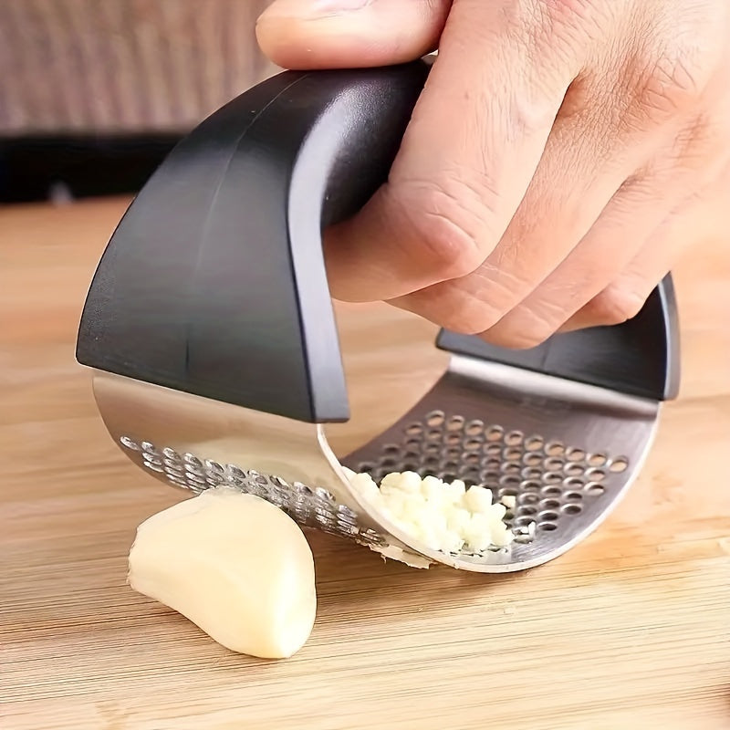 Stainless steel garlic press for easy crushing, ideal for outdoor recreation, travel, camping, and small living spaces.