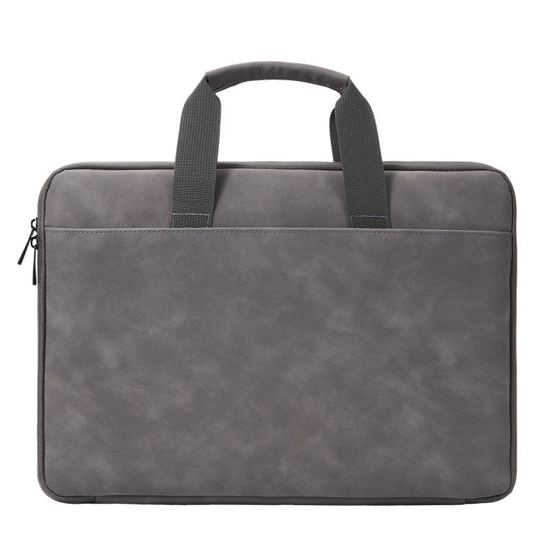 Spacious gray PU leather laptop bag fits 33.02-40.64 cm laptops with organized compartments for essentials.