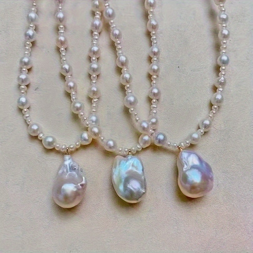 This exquisite freshwater pearl necklace features an OT clasp and a baroque style pendant, suitable for both women and men. It is a classic pearl strand perfect for daily wear or special occasions, including Mardi Gras festivities.