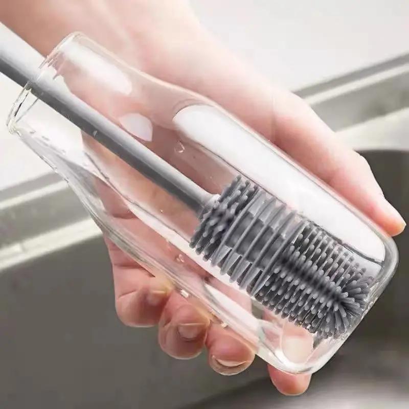 A single piece of the FlexiClean Silicone Bottle Brush featuring a long handle, perfect for deep cleaning without the need for electricity. This multi-purpose brush is ideal for coffee mugs, water bottles, and baby feedingware. The safe and flexible