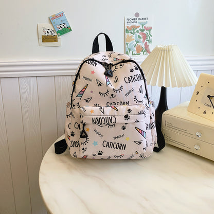 Women's school backpack with cartoon unicorns print, adjustable zipper, and high capacity.