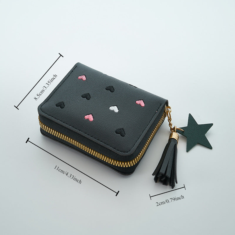 Heart and star embroidered tassel wallet with Korean style, zip-around coin purse. Ideal gift for special occasions. Embroidered clutch in faux leather material.