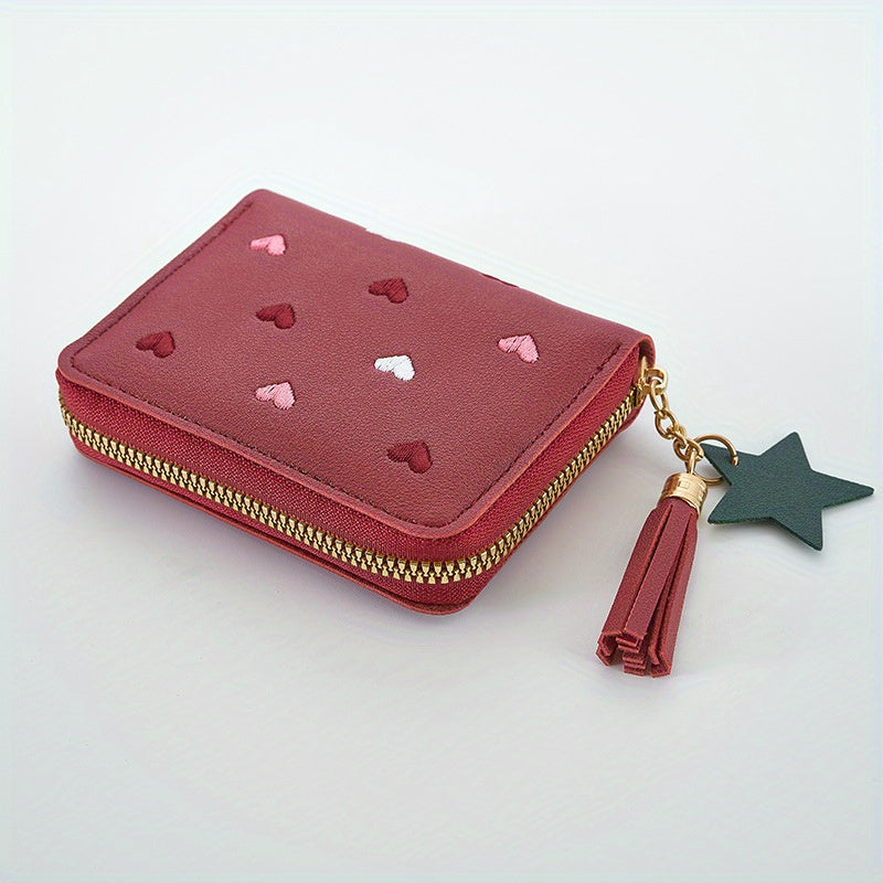 Heart and star embroidered tassel wallet with Korean style, zip-around coin purse. Ideal gift for special occasions. Embroidered clutch in faux leather material.