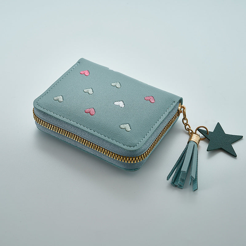 Heart and star embroidered tassel wallet with Korean style, zip-around coin purse. Ideal gift for special occasions. Embroidered clutch in faux leather material.