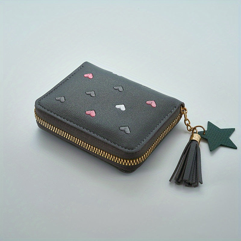 Heart and star embroidered tassel wallet with Korean style, zip-around coin purse. Ideal gift for special occasions. Embroidered clutch in faux leather material.