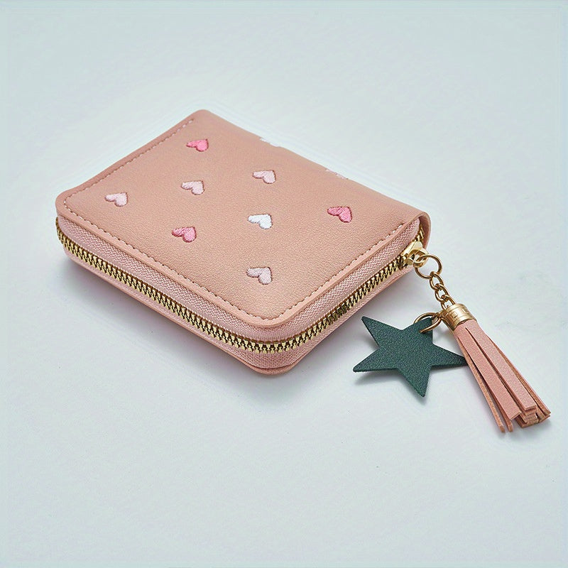 Heart and star embroidered tassel wallet with Korean style, zip-around coin purse. Ideal gift for special occasions. Embroidered clutch in faux leather material.