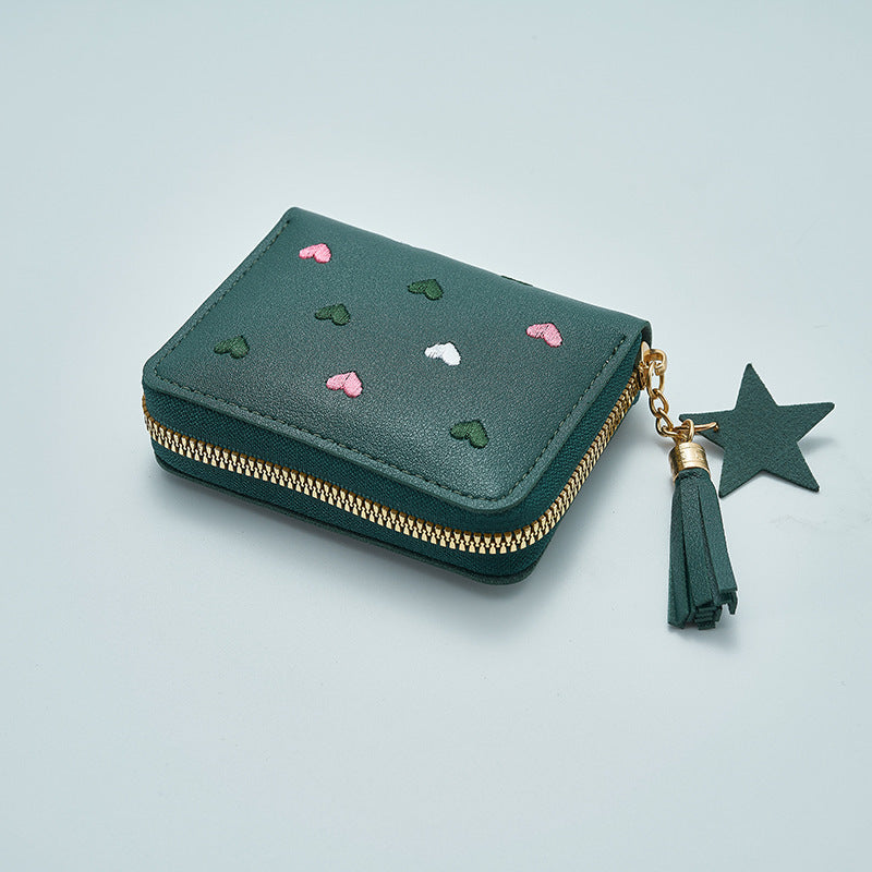 Heart and star embroidered tassel wallet with Korean style, zip-around coin purse. Ideal gift for special occasions. Embroidered clutch in faux leather material.