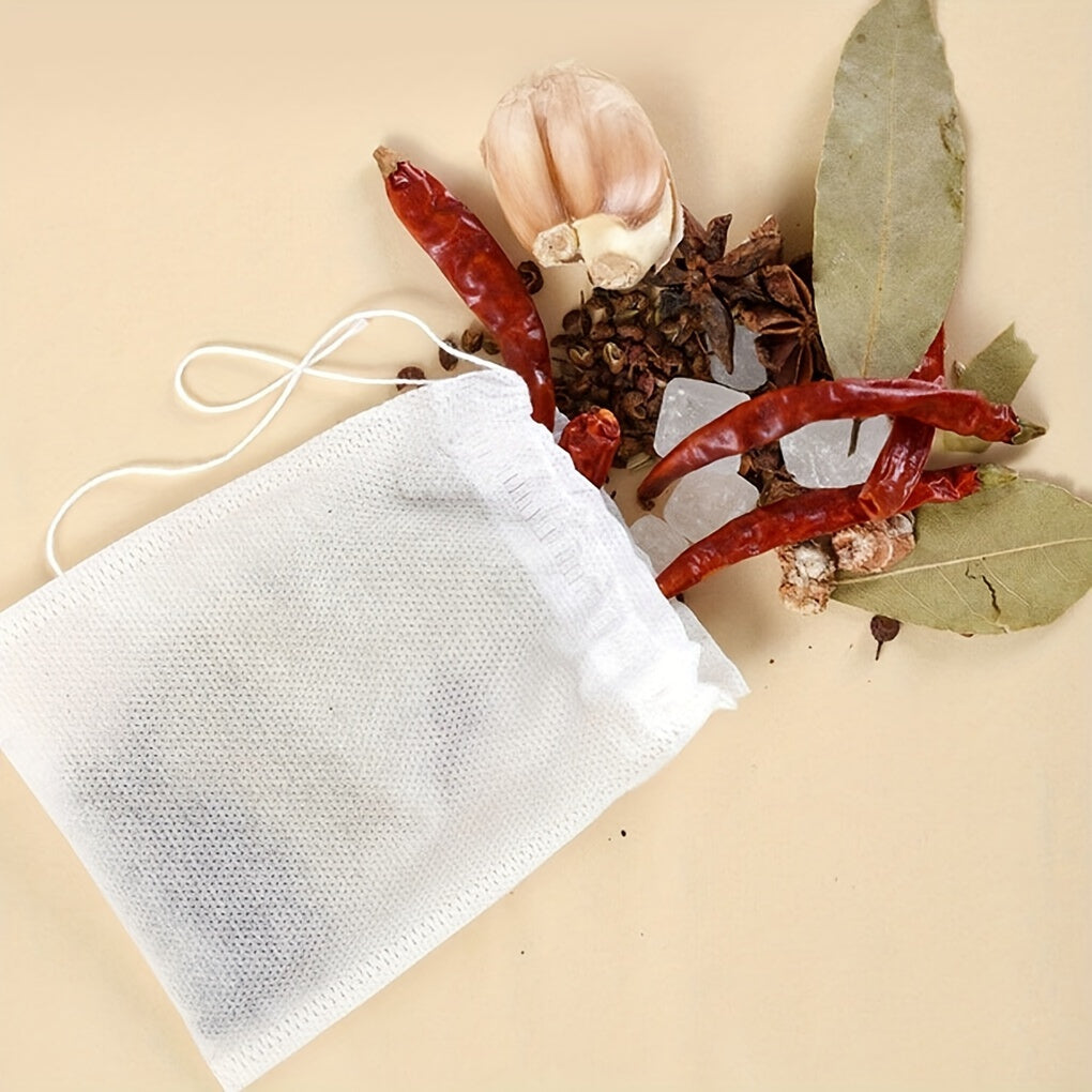 100 pieces of Disposable Drawstring Tea Bags, specifically designed for Loose Leaf Herbs and Spices, featuring an Empty Heat Seal Tea Infuser Filters that allows for easy brewing.