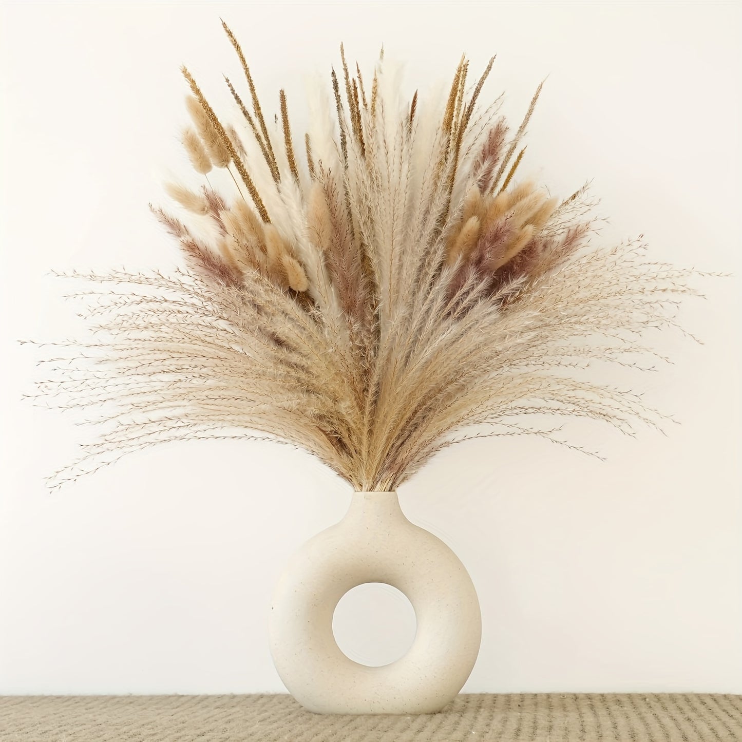 120 pieces of dried pampas grass in natural white and beige varieties for boho home decor, weddings, and office decoration. Perfect for creating an elegant centerpiece with a bohemian touch