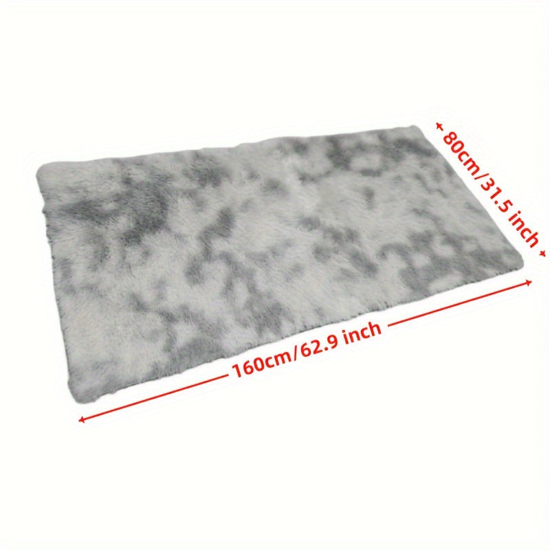 Soft and fluffy light gray rug with non-slip bottom, perfect for bedroom or living room.