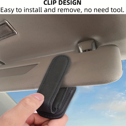 Stylish magnetic PU leather glasses holder for car visor with black textured grip. Compact design for easy access and secure storage.