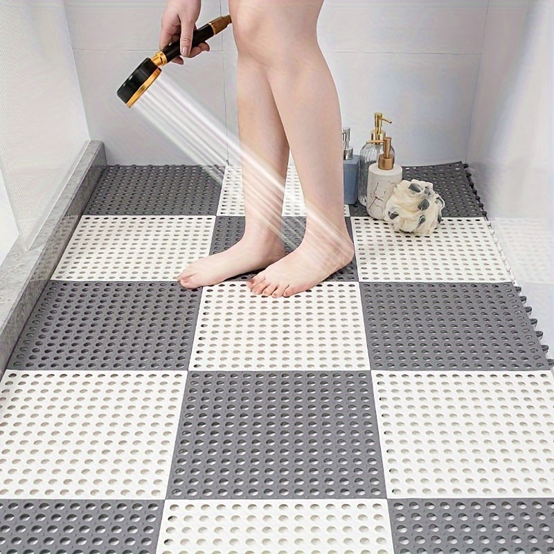 Keep your bathroom safe with this pack of four non-slip shower mats, complete with drainage holes for quick drying. Made of durable polyester, these mats are easy to install with their interlocking design, ensuring safety and stability in your home