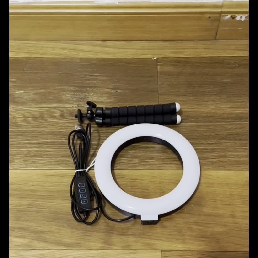 Adjustable LED ring light with USB power, flexible bracket, and 3 modes, 10 levels of brightness for smartphones and cameras.