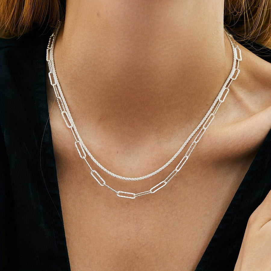 2-piece set includes a boho chic 925 silvery plated necklace and bracelet featuring a multi-layer paperclip chain design. This set is perfect for daily wear or as a stylish party accessory.