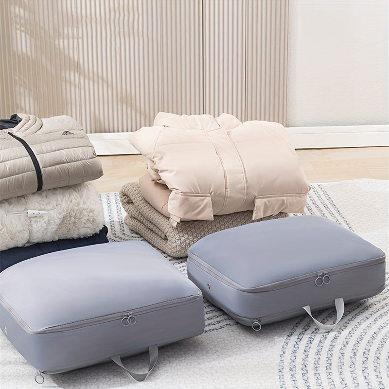 A set of 2 compression packing cubes that expand to save space, perfect for organizing blankets, bedding, and travel accessories. These durable cubes offer portable and heavy-duty storage solutions.