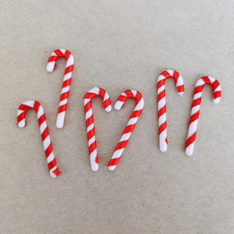 15 mini Christmas candy canes with Santa Claus theme, red and white ornaments for tree and party decor.