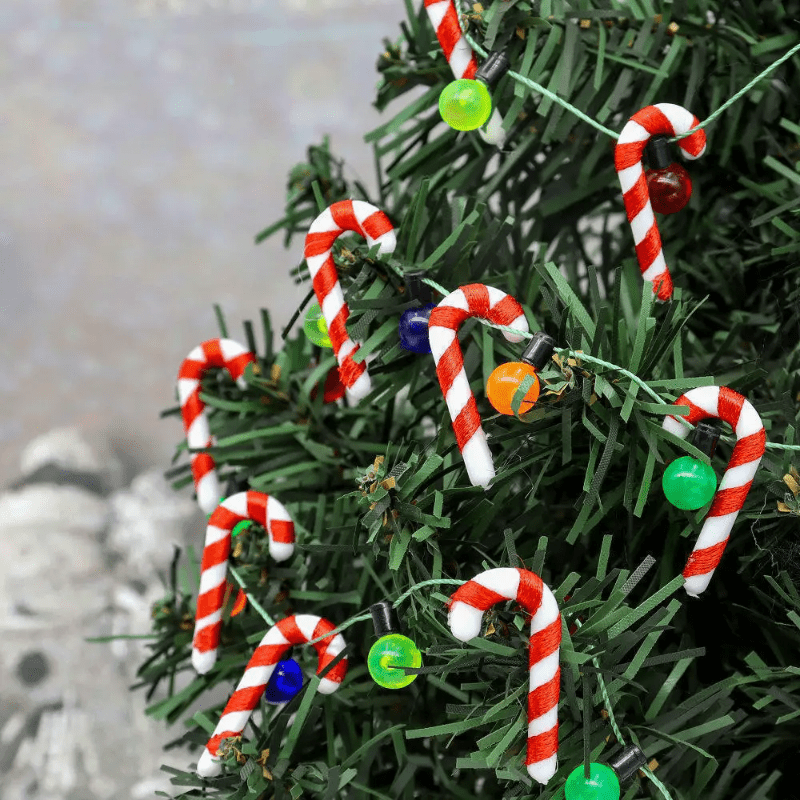 15 mini Christmas candy canes with Santa Claus theme, red and white ornaments for tree and party decor.