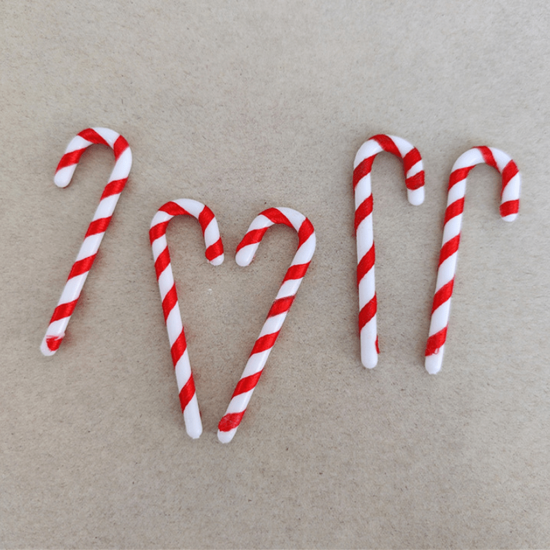 15 mini Christmas candy canes with Santa Claus theme, red and white ornaments for tree and party decor.