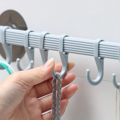 1 piece of strong adhesive hook with 6 hooks for hanging on kitchen walls, corners, or bathrooms without leaving any marks. Useful for hanging clothes and other items.