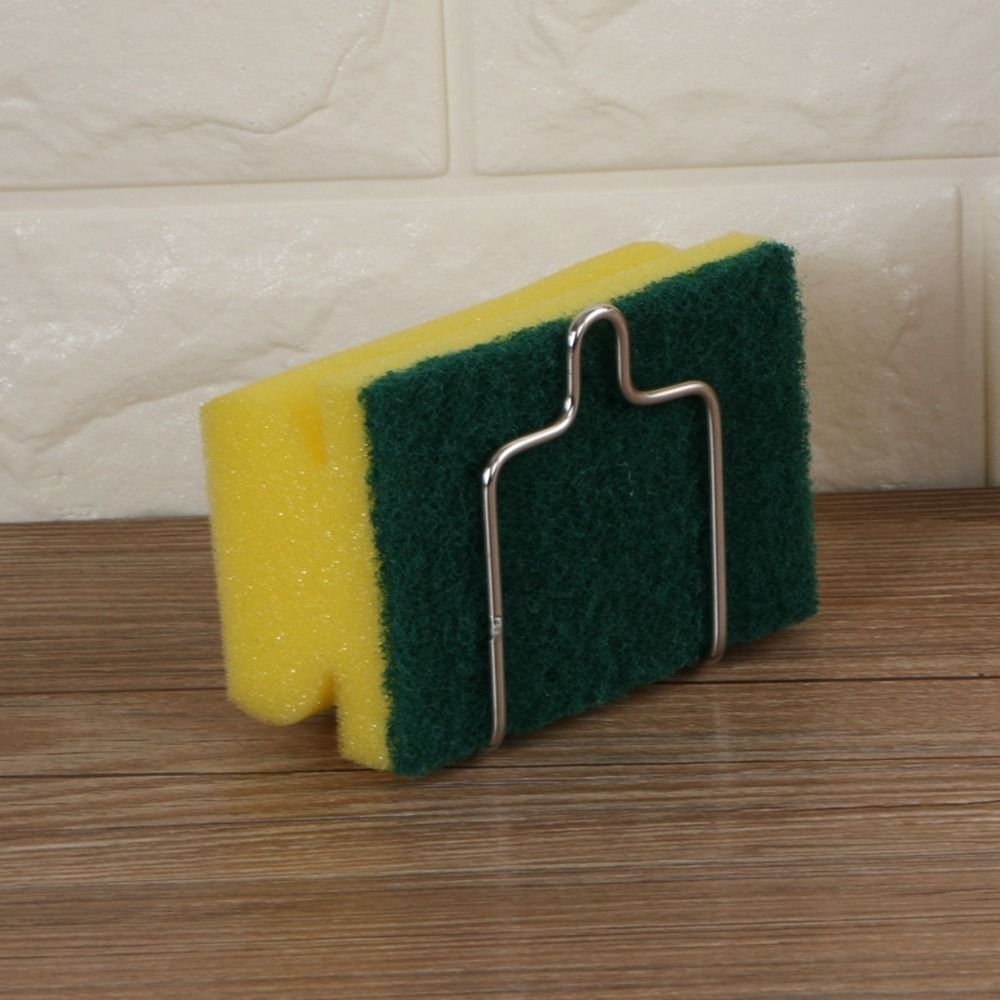 Holder for sponges and towels made from stainless steel, with a suction cup for easy mounting on walls. Resistant to rust, this organizer is suitable for use in kitchens and bathrooms. No drilling required for installation, and the space-saving design