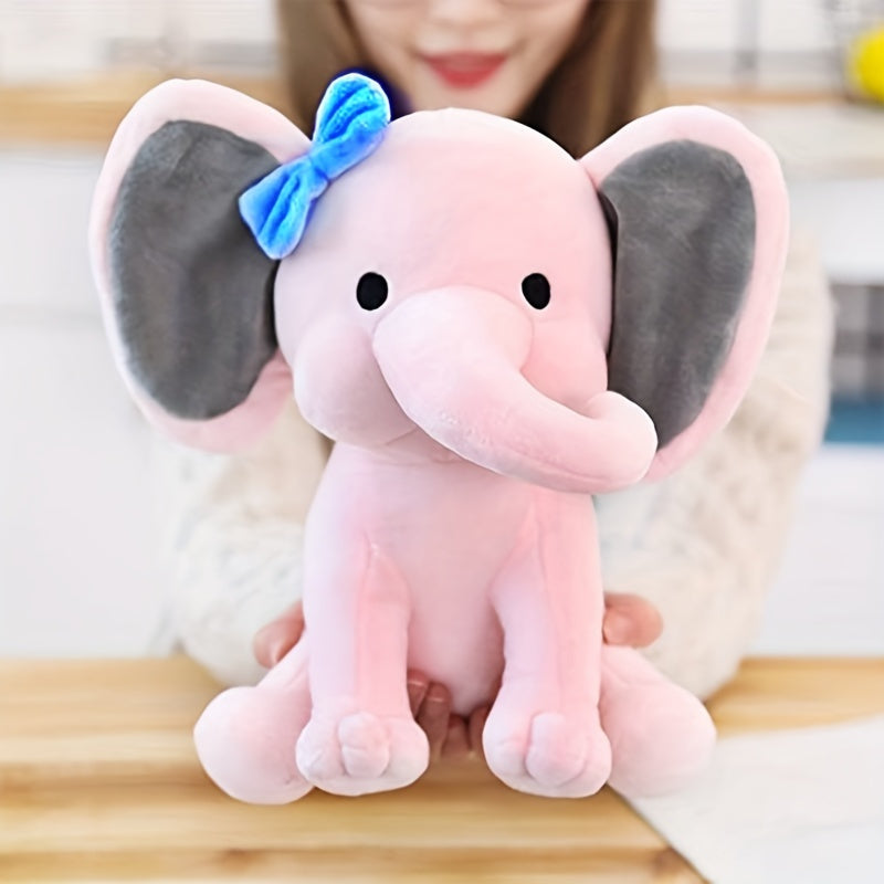 Soft and cuddly elephant plush toy, perfect for young children. Made of soft polyester, this is an ideal gift for both boys and girls. Great for parties and playtime. Available in bright pink and grey colors.