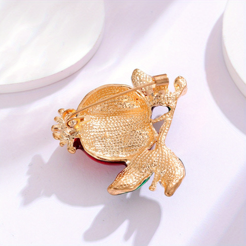 Stylish pomegranate brooch adorned with shimmering rhinestones, featuring a fruity emblem from the fruit series, a perfect accessory for any outfit.