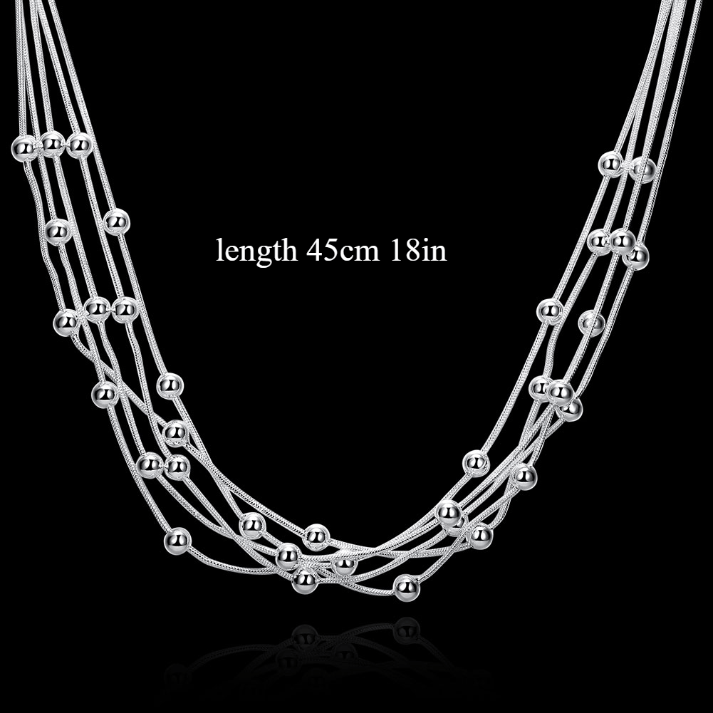 Stunning women's fine jewelry plated in a beautiful sterling silver color necklace. The 45.72cm necklace features five lines of beads on a snake chain, with charm balls for a unique and elegant look. This multilayer necklace is perfect for a lady to wear