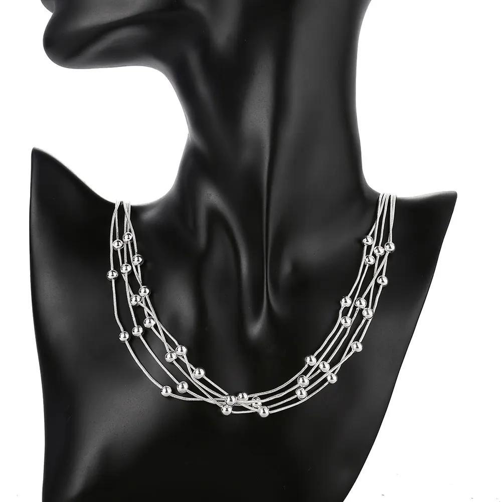 Stunning women's fine jewelry plated in a beautiful sterling silver color necklace. The 45.72cm necklace features five lines of beads on a snake chain, with charm balls for a unique and elegant look. This multilayer necklace is perfect for a lady to wear