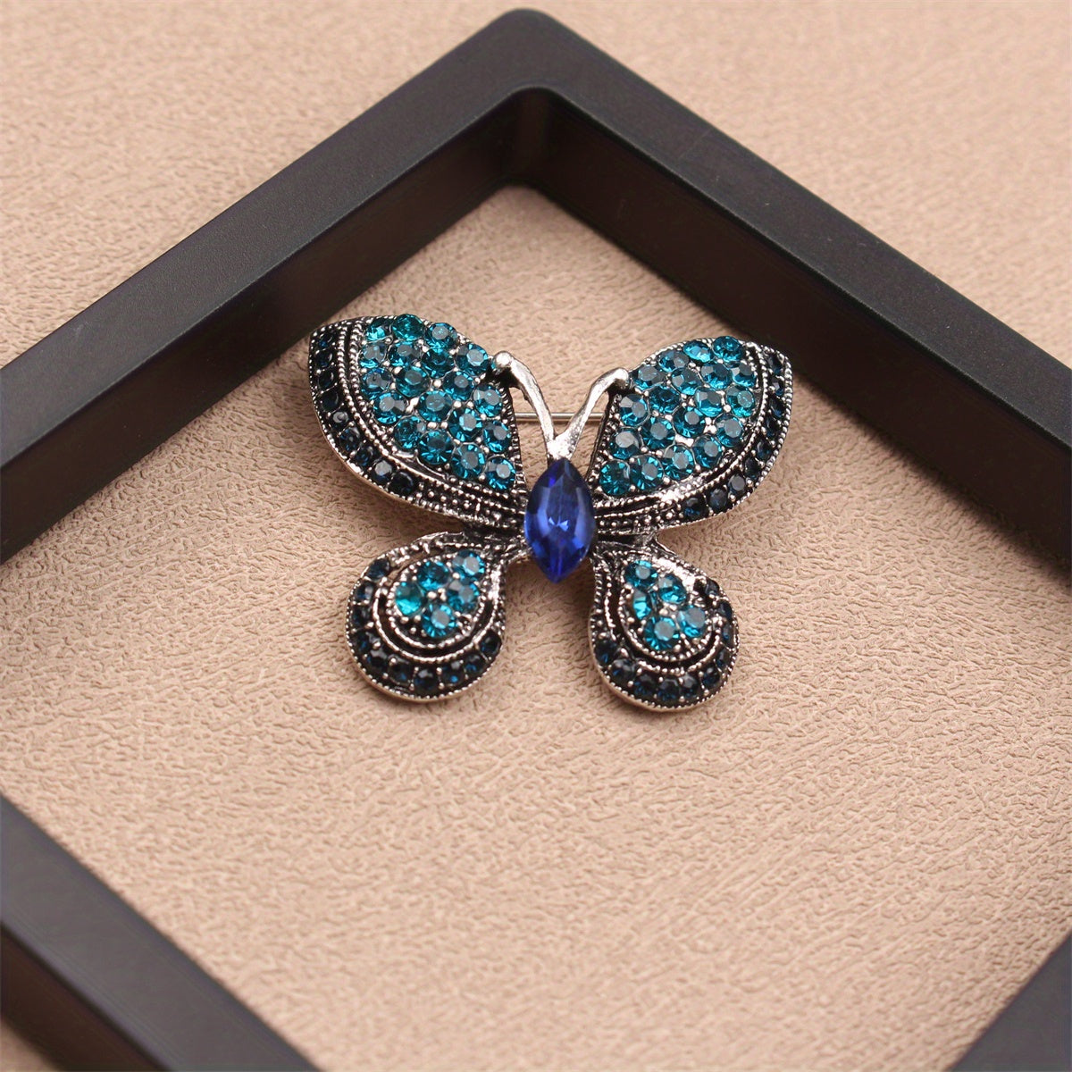 A Sophisticated Rhinestone Butterfly Brooch: Elevate Your Charm with this Versatile Accessory