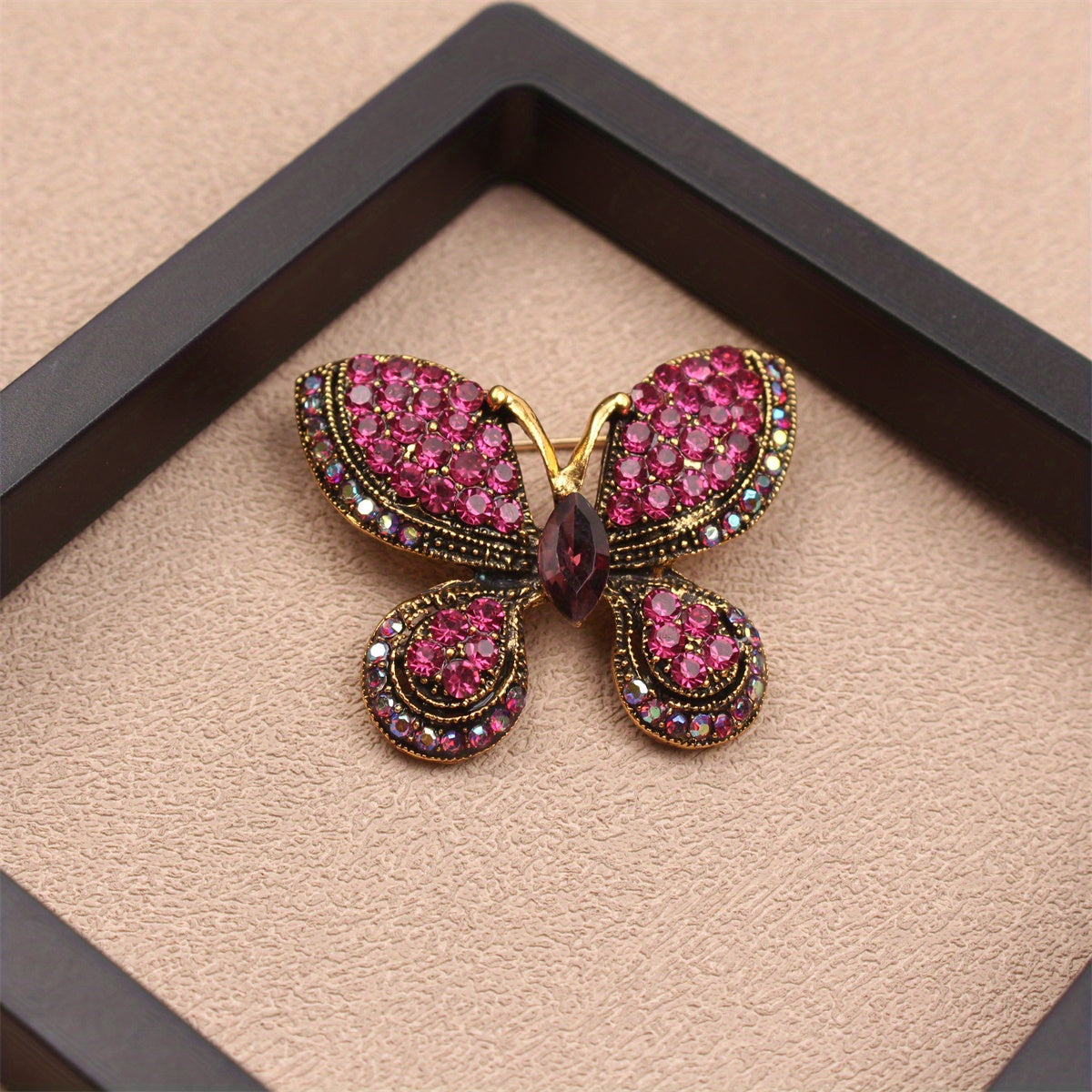 A Sophisticated Rhinestone Butterfly Brooch: Elevate Your Charm with this Versatile Accessory