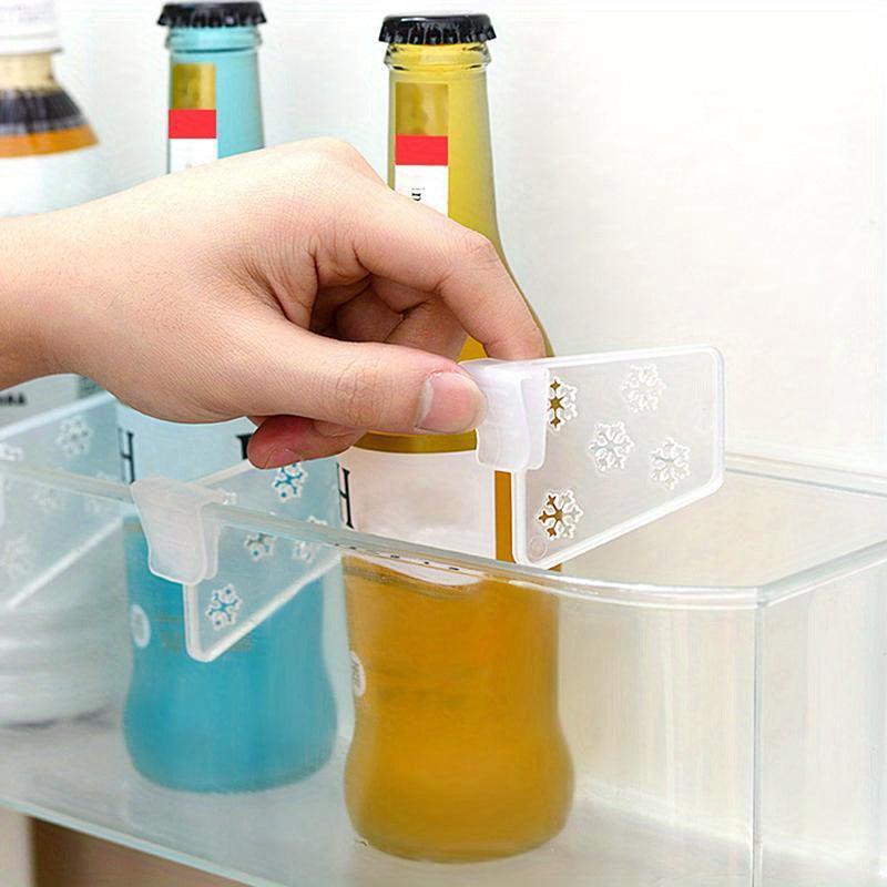 Set of 4 clear plastic refrigerator storage boxes in classic style, with partition clips. Made without any wood ingredients and requiring no electricity to operate.