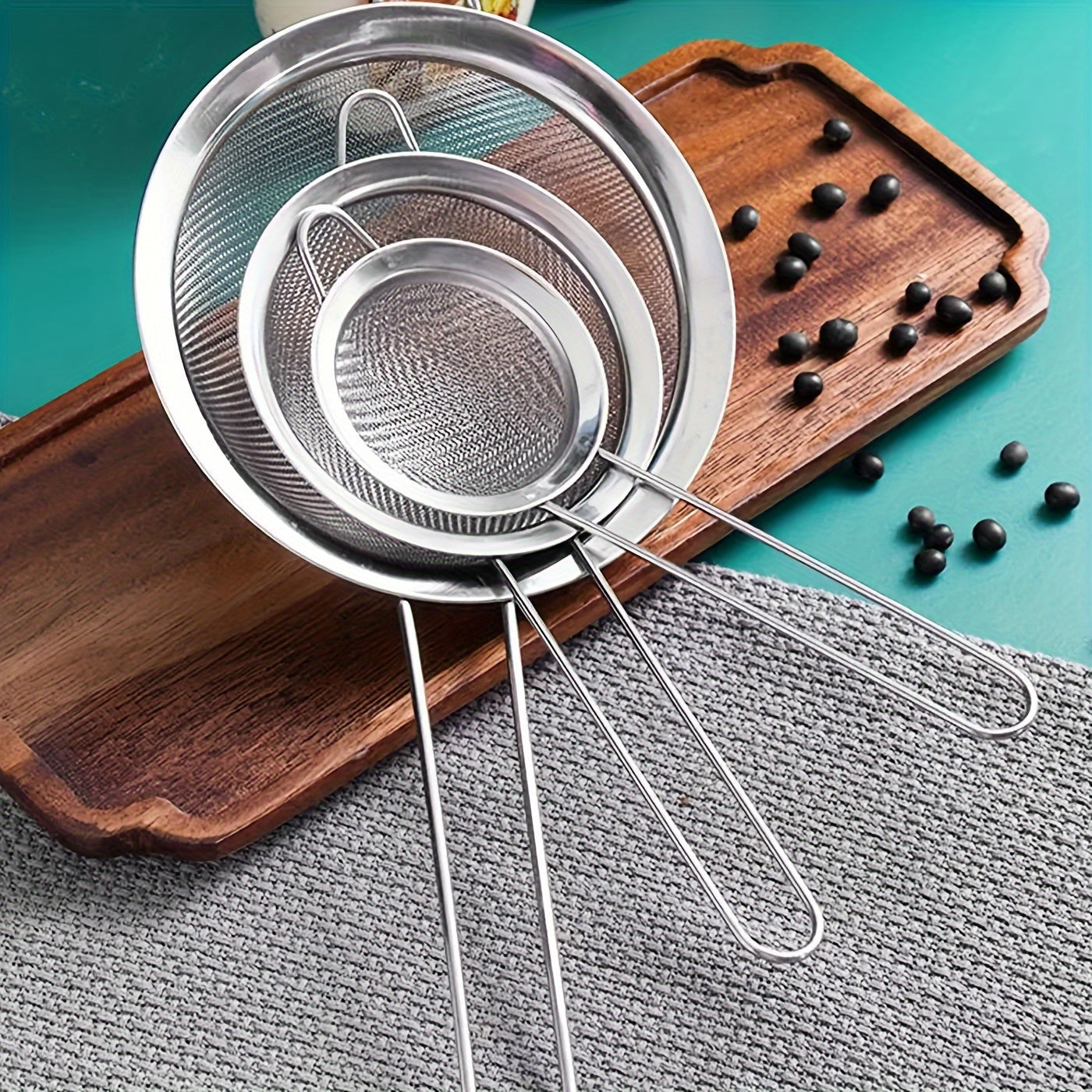 Set of 3 stainless steel fine mesh strainers with ergonomic handles - ideal for making smooth sauces and sifting flour in the kitchen. These kitchen essentials are durable, rust-resistant, and built to last.