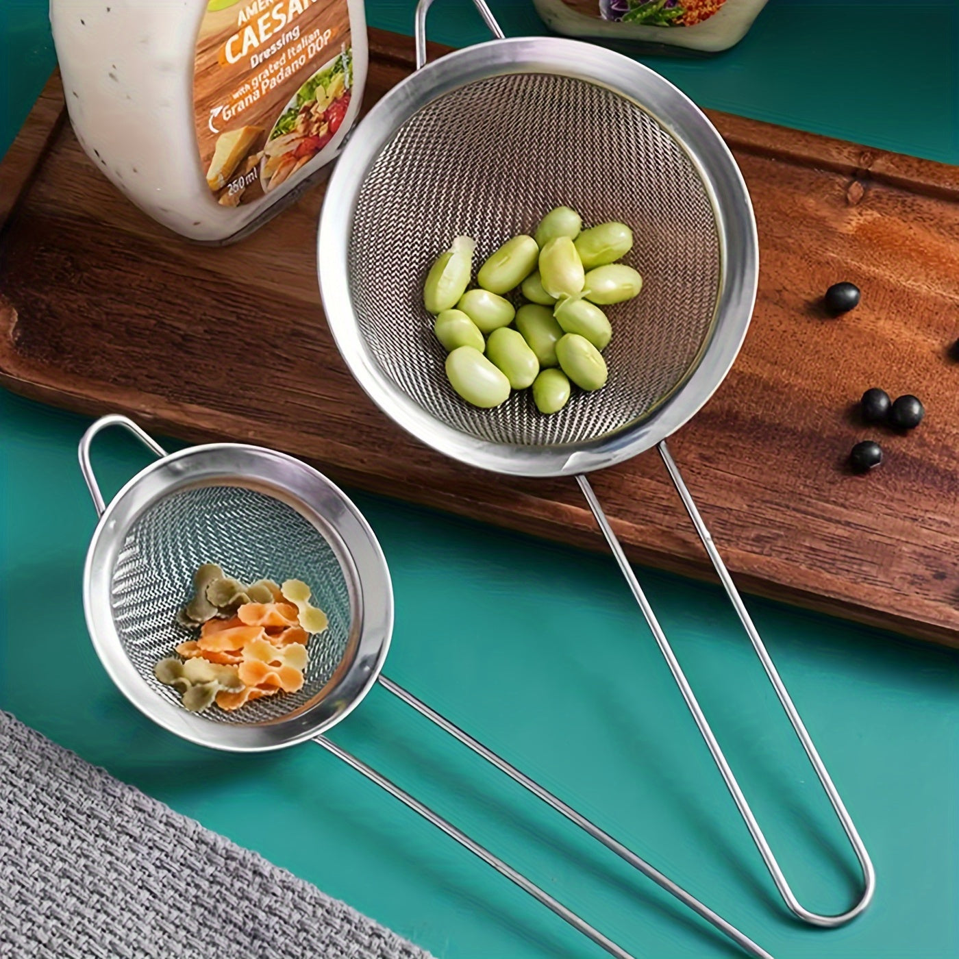 Set of 3 stainless steel fine mesh strainers with ergonomic handles - ideal for making smooth sauces and sifting flour in the kitchen. These kitchen essentials are durable, rust-resistant, and built to last.