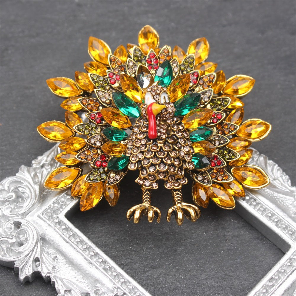 Elevate your style with this stunning Elegant Luxury Peacock Brooch Pin, featuring an irregular shaped rhinestone design. This high-quality accessory is perfect for both men and women and is sure to add a touch of elegance to any outfit.