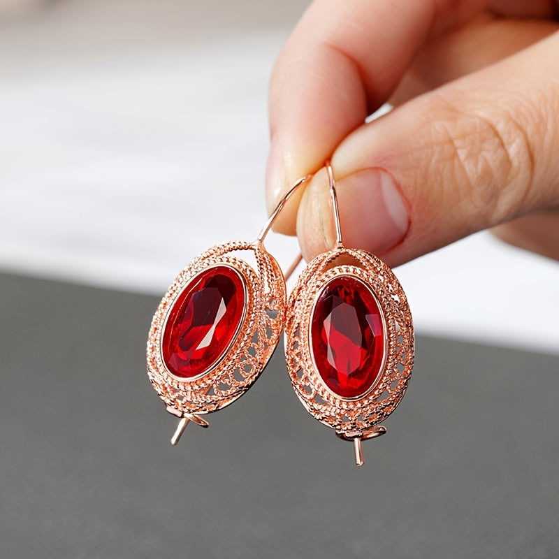 One pair of vintage-inspired rose golden hoop earrings with synthetic garnet, perfect for parties and special occasions. Made of nickel-free copper, suitable for all-season wear.