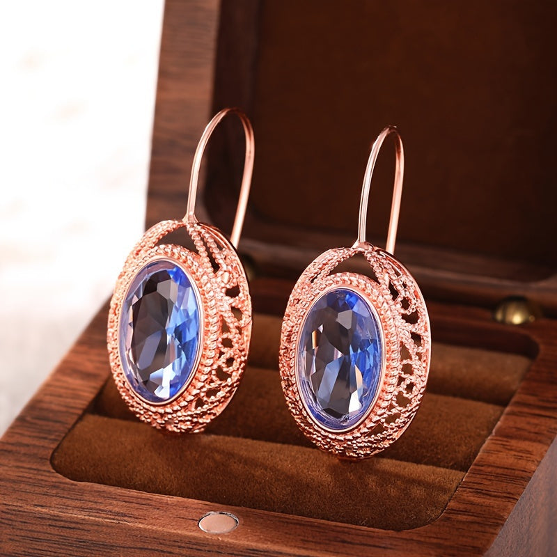 One pair of vintage-inspired rose golden hoop earrings with synthetic garnet, perfect for parties and special occasions. Made of nickel-free copper, suitable for all-season wear.