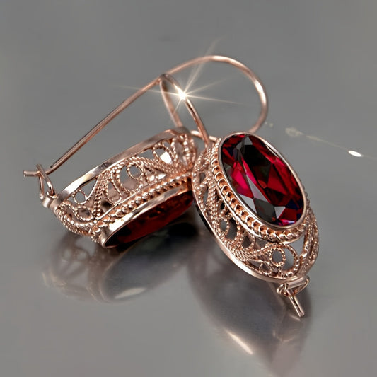 One pair of vintage-inspired rose golden hoop earrings with synthetic garnet, perfect for parties and special occasions. Made of nickel-free copper, suitable for all-season wear.