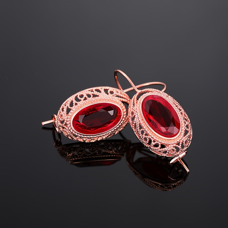 One pair of vintage-inspired rose golden hoop earrings with synthetic garnet, perfect for parties and special occasions. Made of nickel-free copper, suitable for all-season wear.