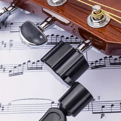 Guitar string winder tool for loosening strings.